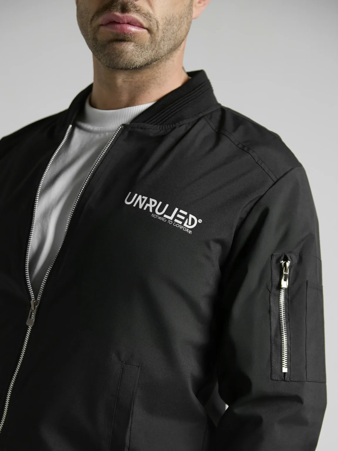 Statement bomber jacket with artistic graphics and contemporary streetwear design.