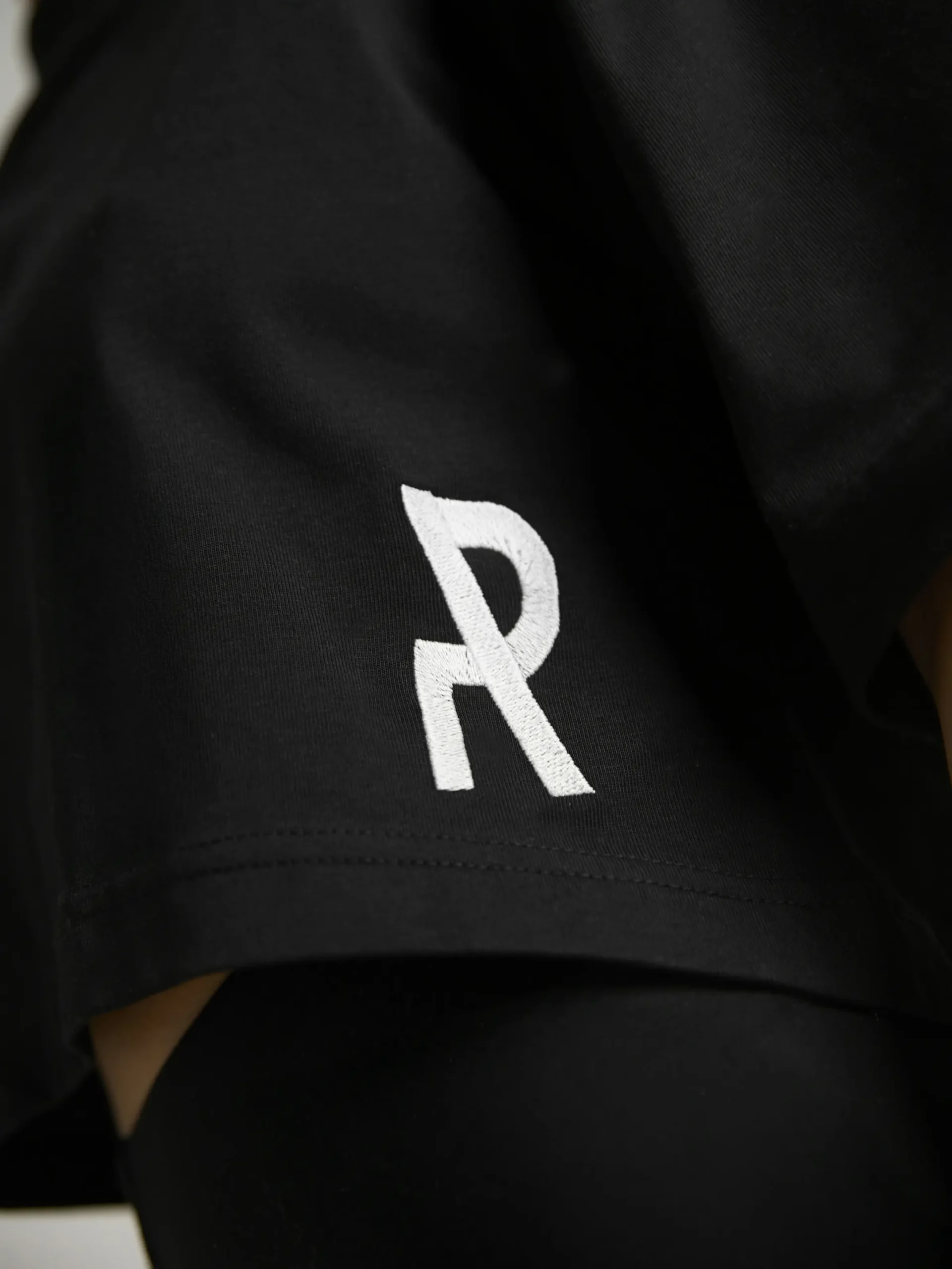 Minimalist women's streetwear styling with the UNRULED black crop top.