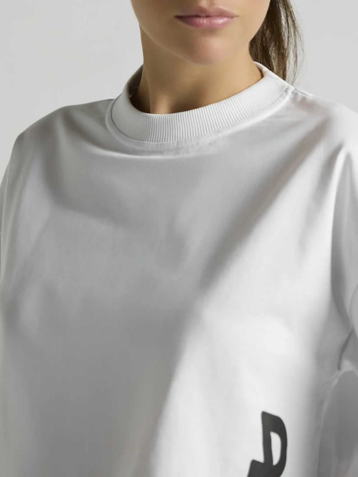 White cropped top for women by UNRULED featuring a modern streetwear fit.