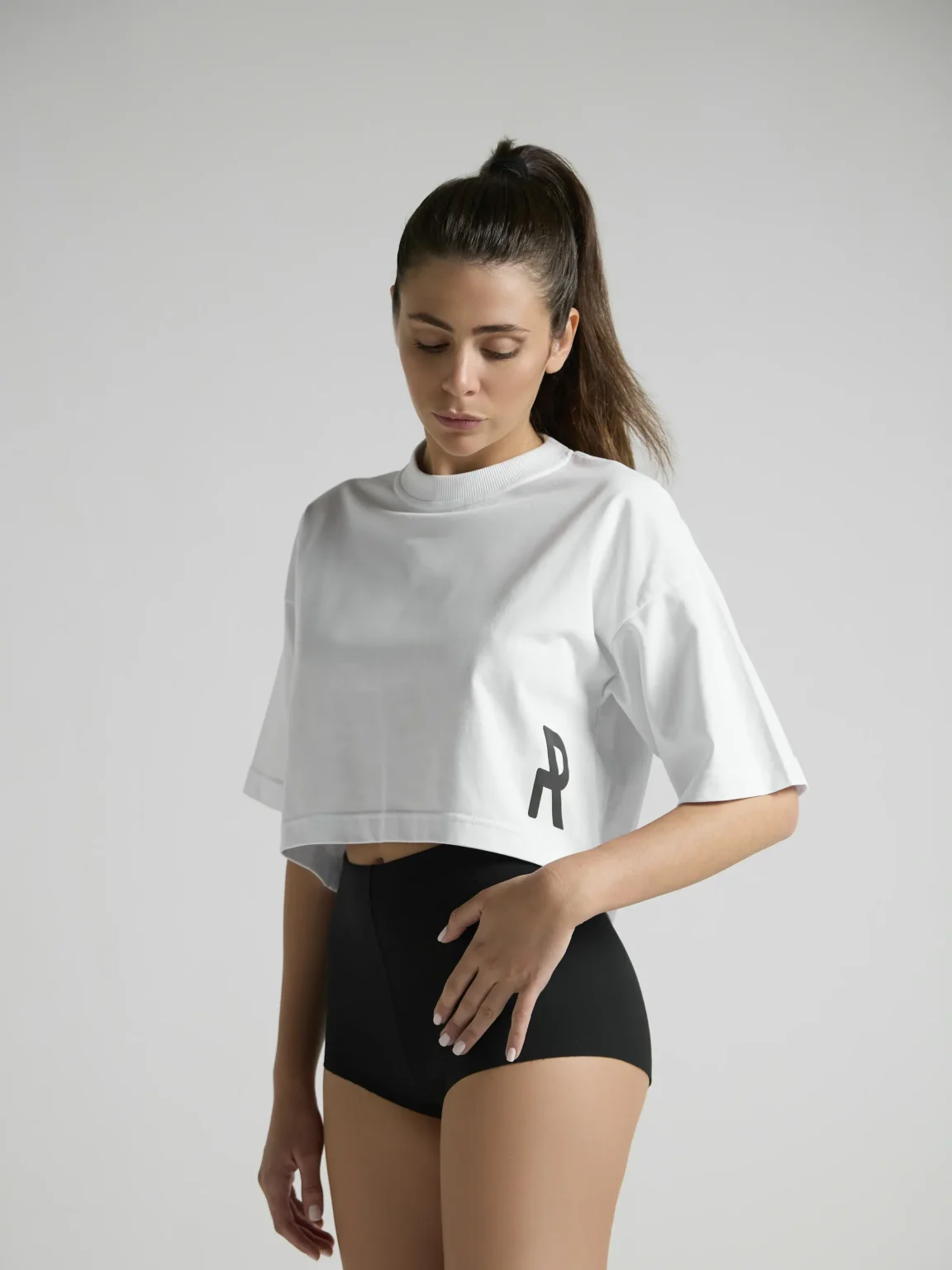 White cropped top for women by UNRULED featuring a modern streetwear fit.