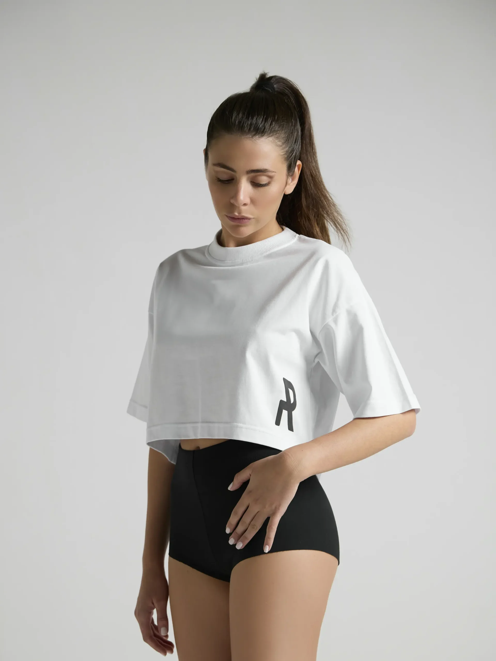 White cropped top for women by UNRULED featuring a modern streetwear fit.