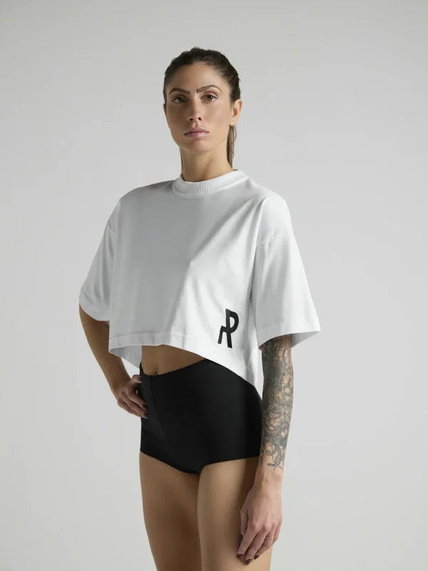 UNRULED white crop top combining comfort and contemporary style.