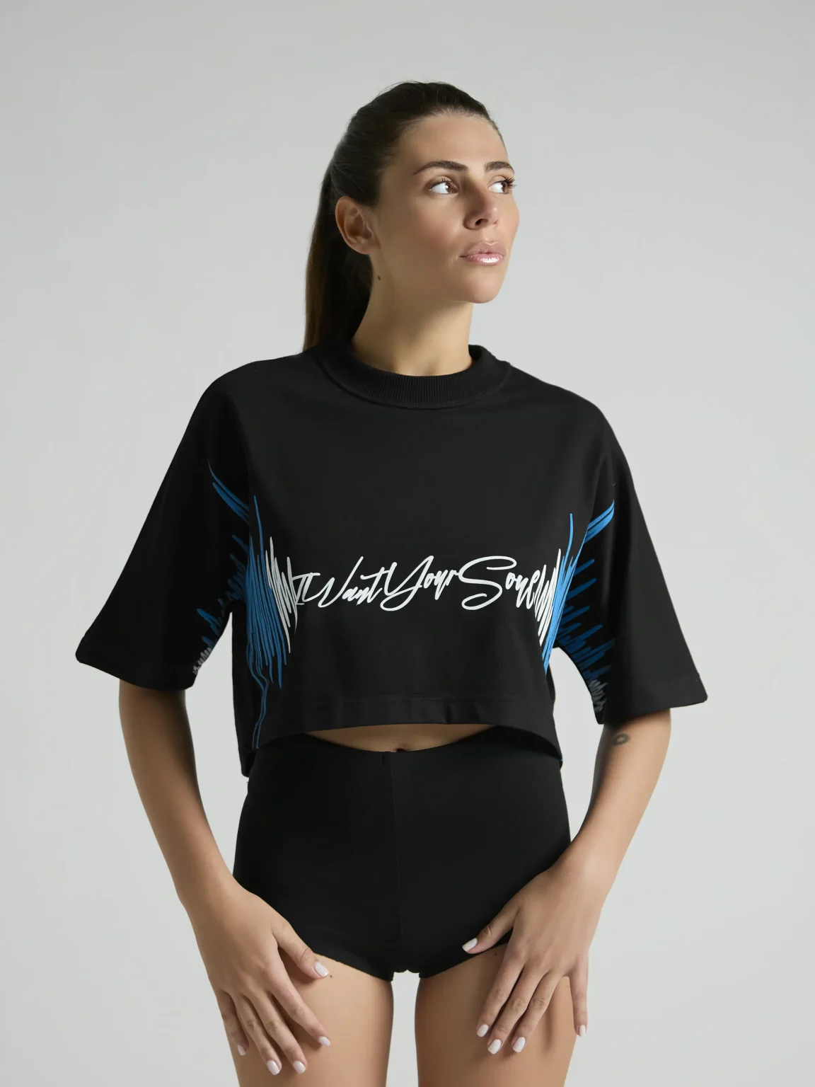 Black women's cropped T-shirt from UNRULED BEAT collection with immersive DJ-inspired artwork.