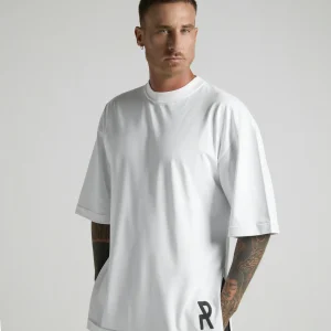 UNRULED white oversized T-shirt featuring a minimalist contemporary design.