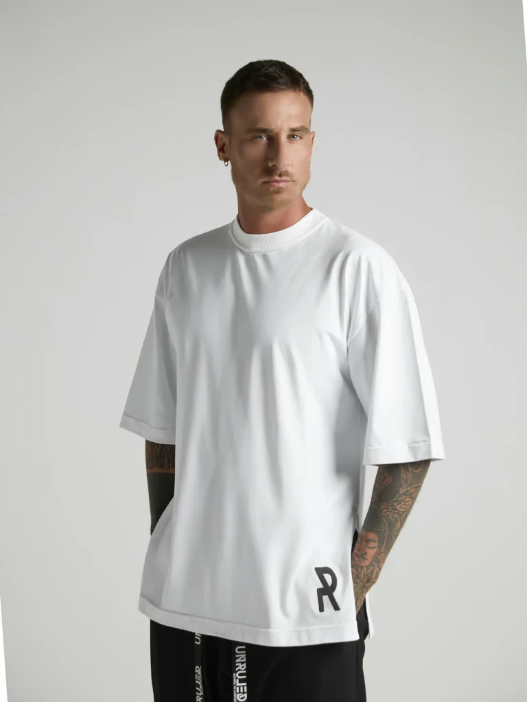 UNRULED white oversized T-shirt featuring a minimalist contemporary design.