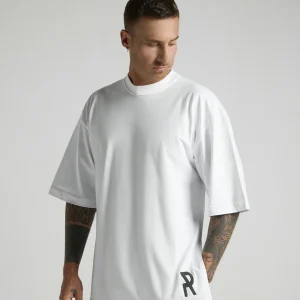NRULED INSIDE white oversized T-shirt photographed in an editorial fashion setting.
