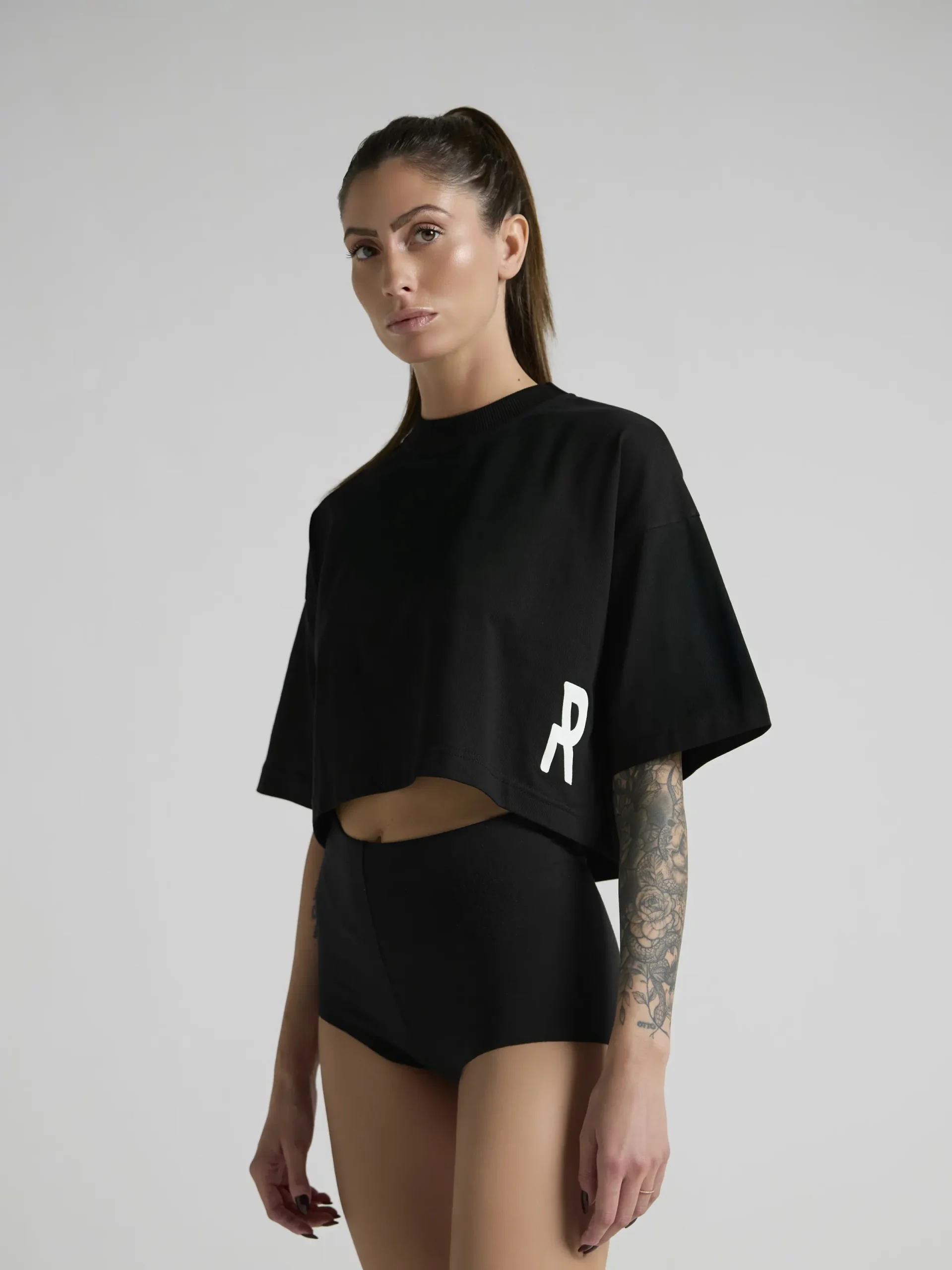 Women's black cropped T-shirt crafted from premium cotton and made in Italy.