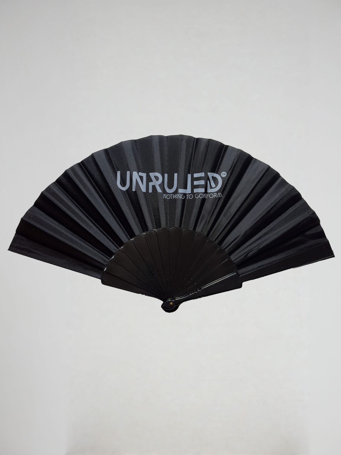 UNRULED folding fan featuring minimalist contemporary design and premium craftsmanship.