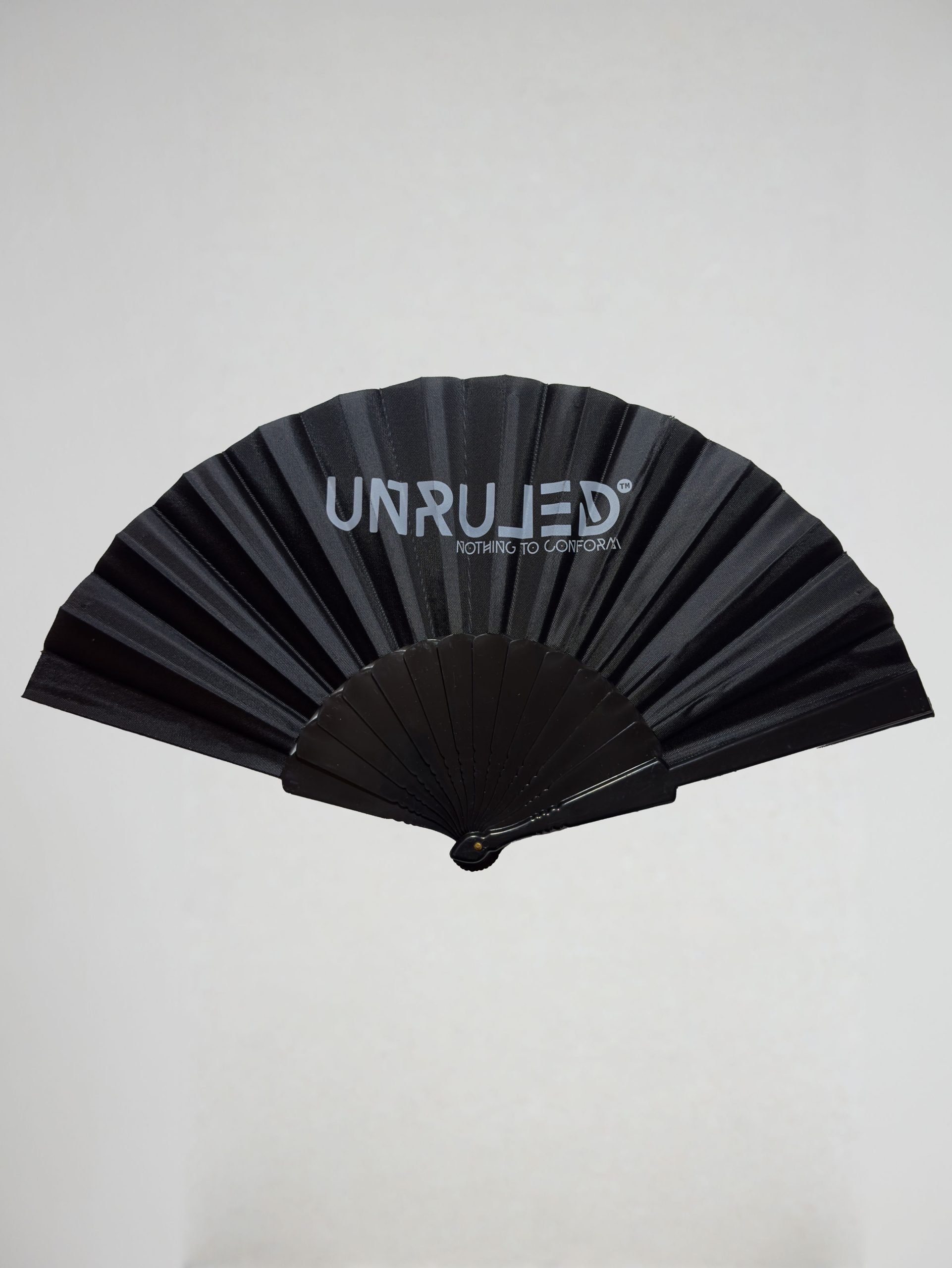 UNRULED folding fan featuring minimalist contemporary design and premium craftsmanship.